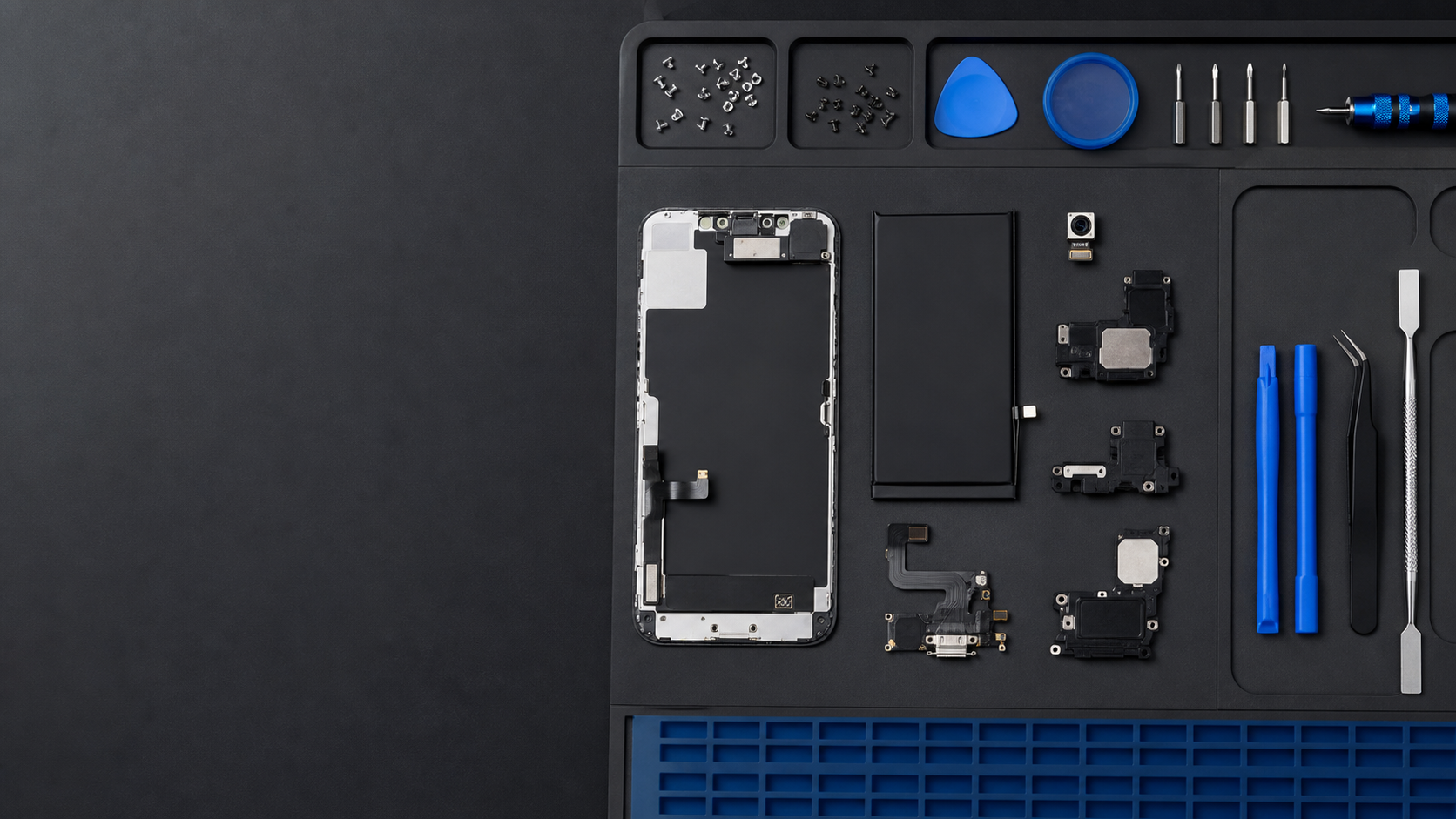 Device parts and tools on a workbench